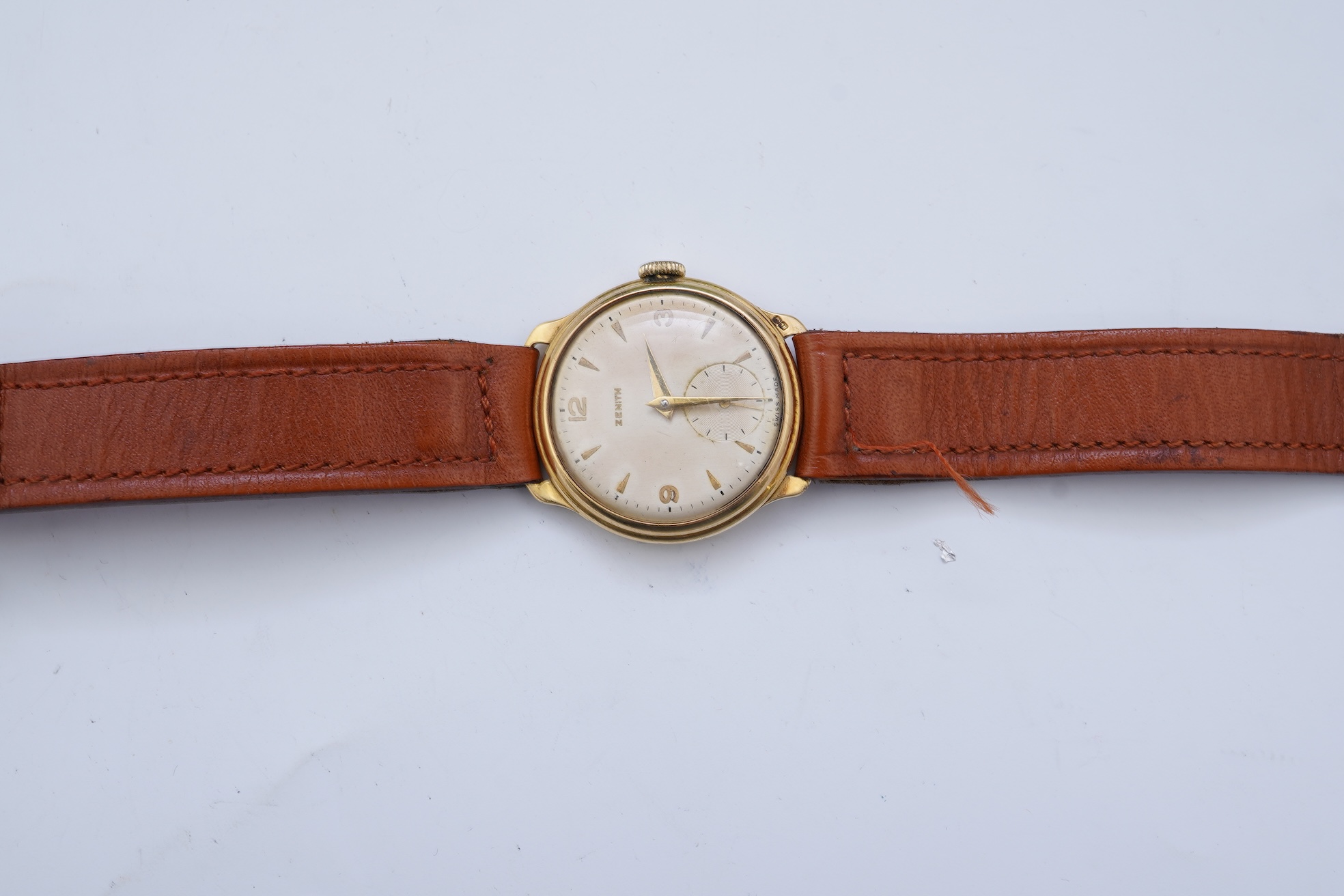A gentleman's 1950's 18ct gold Zenith manual wind wrist watch